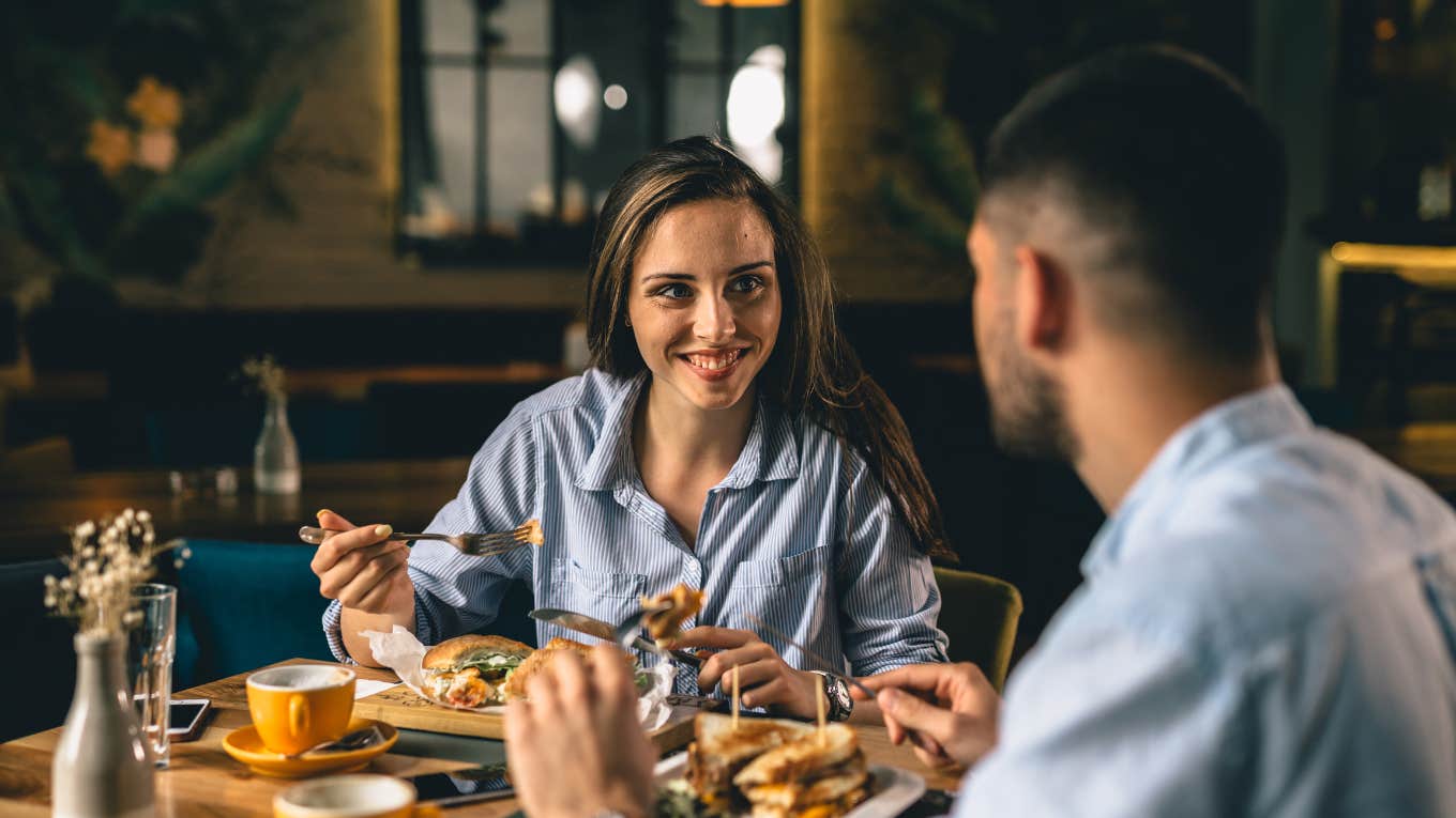 happy young couple having dinner at a fancy restaurant