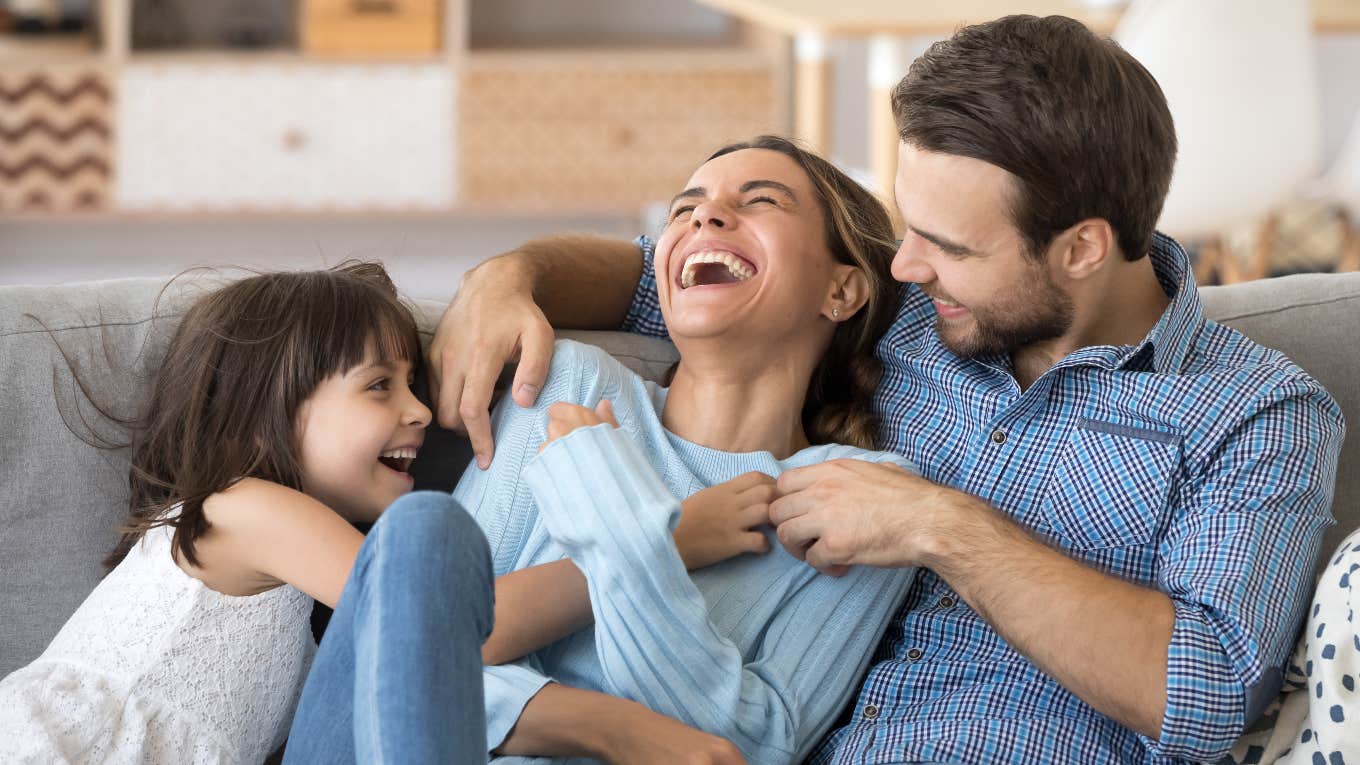 happy husband, wife and daughter