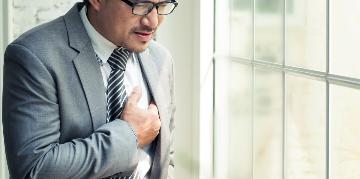 Businessman having a heart attack