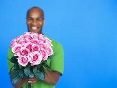 man holding bouquet of roses