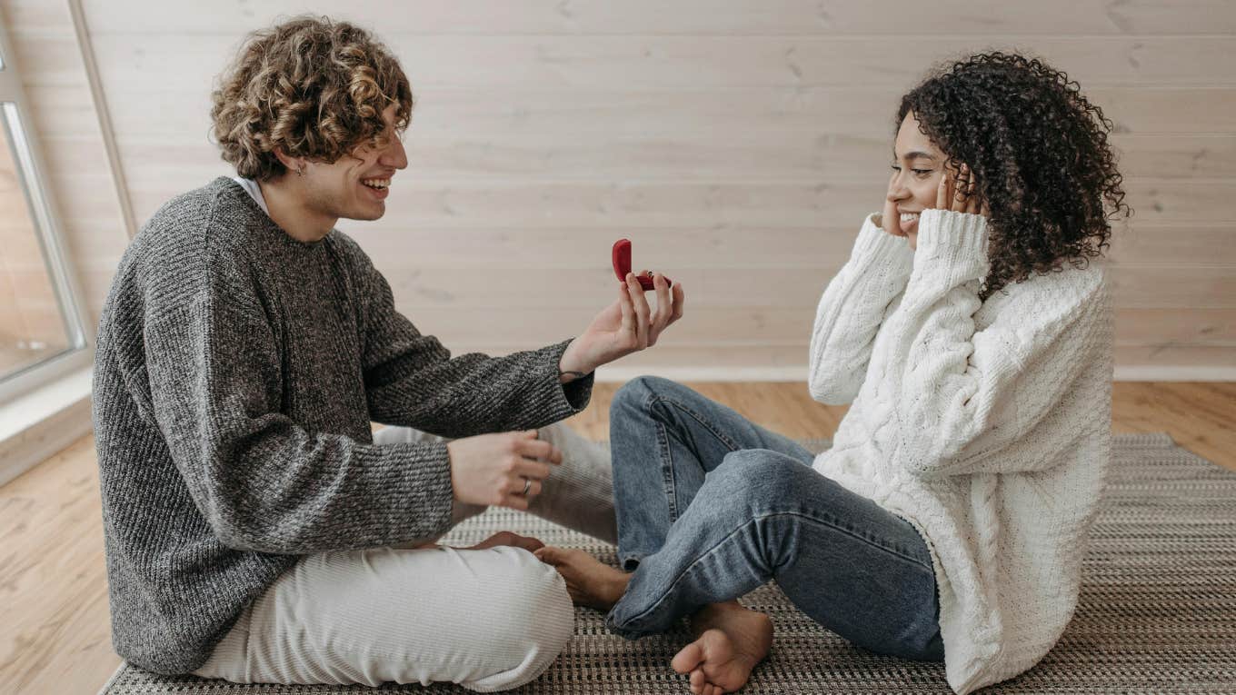 Man Kicks His Girlfriend Out of their Apartment For Asking to Think About His Marriage Proposal man proposing to woman with a ring
