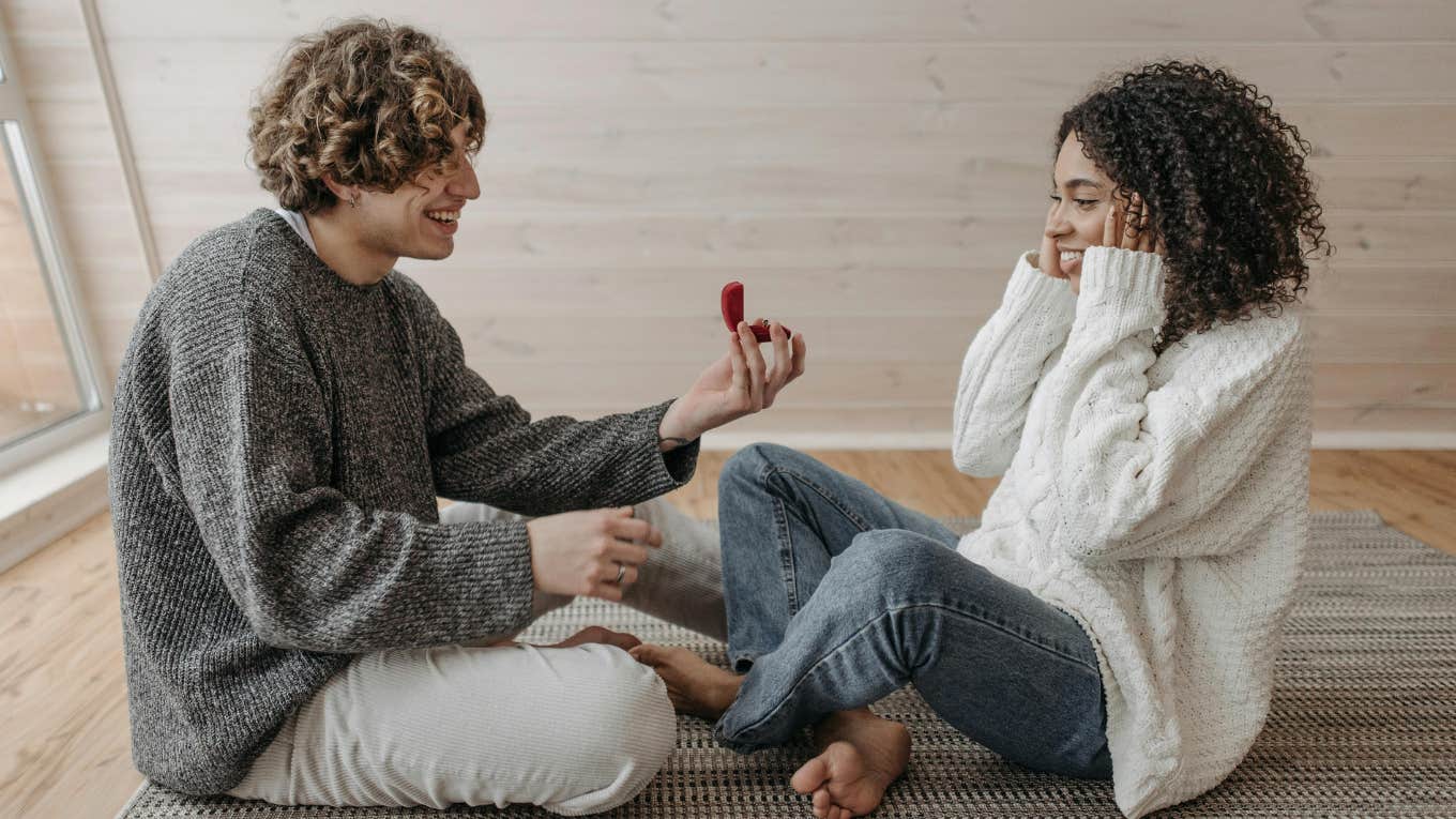 man proposing to woman with a ring