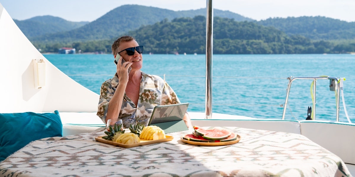 Man Who Lives On A Cruise Ship 300 Days A Year Because It's Cheaper Than Rent Shows Just How Impossible It Is To Survive The Costs Of Living A man is on a cruise ship doing work.