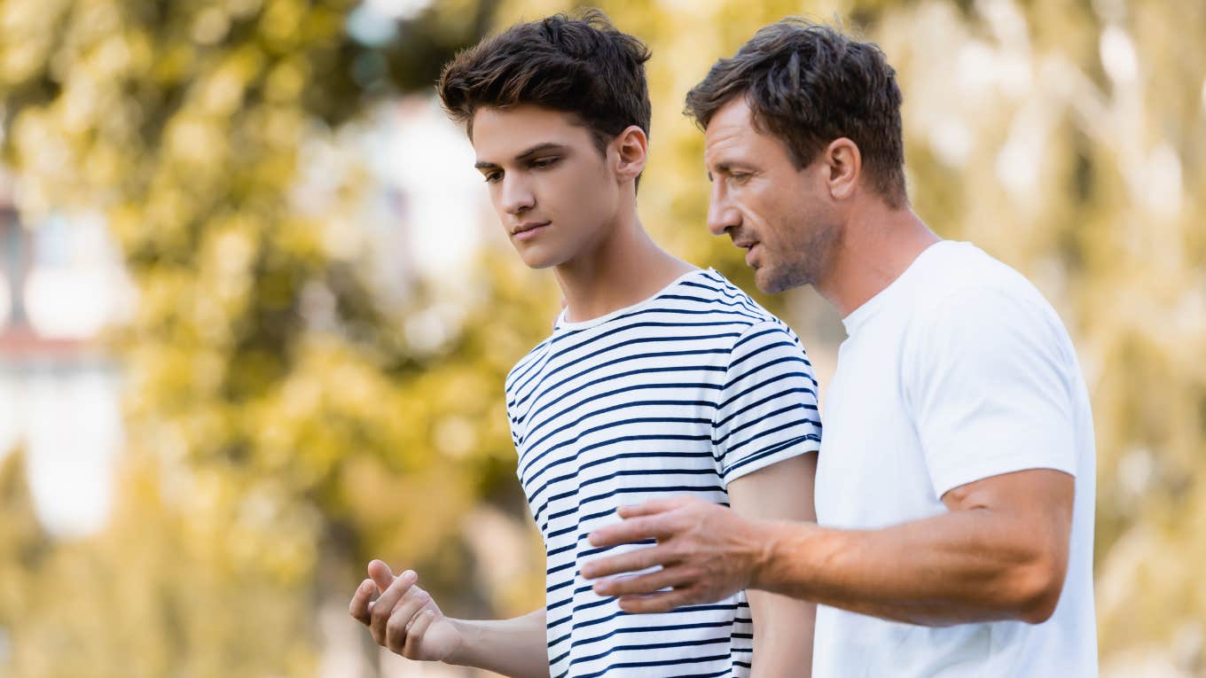 man talking to teen 