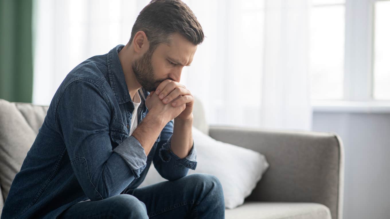 sad, thoughtful man looking at ground