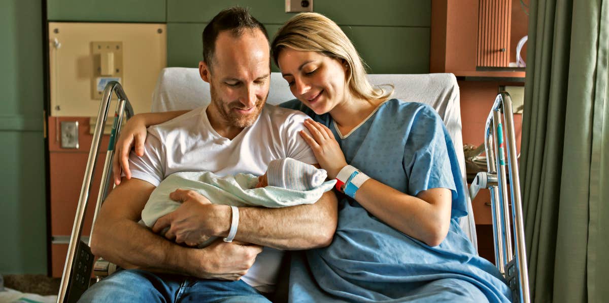 Couple at the hospital with their baby