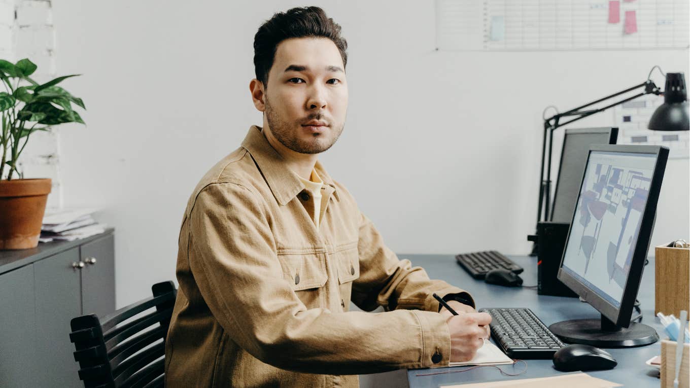 man sitting at desk 