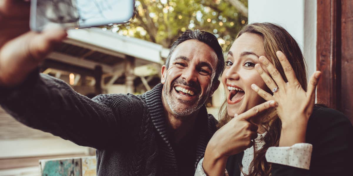 Man Rethinks The Engagement After He Found Out About His Fiancée's Cosmetic Surgery Engaged couple taking a picture