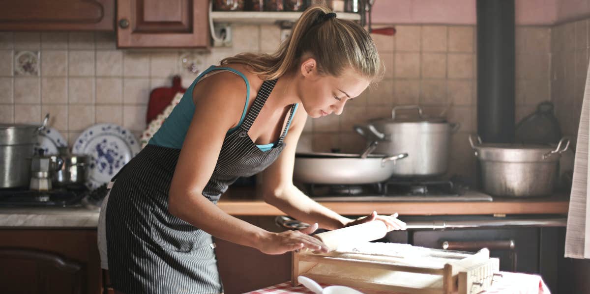 Man Ridicules His Date After She Reveals Her Dream Of Being A Childfree Housewife woman baking in the kitchen
