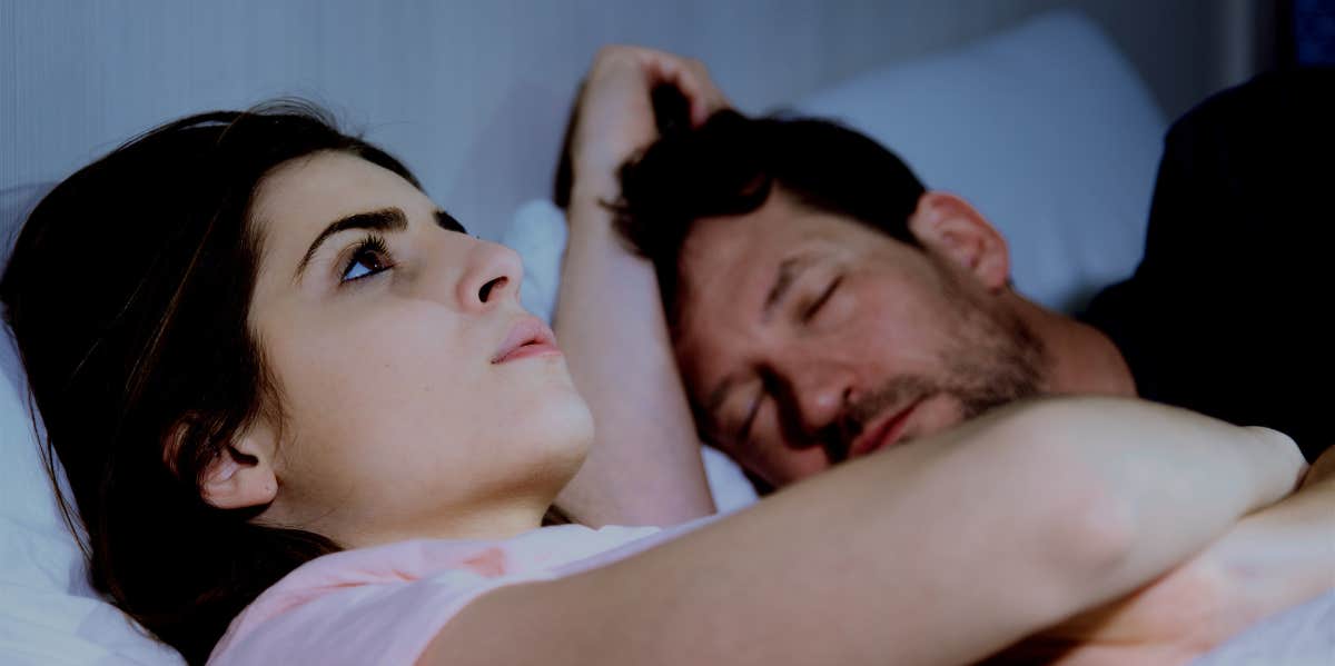 Woman's Husband Says Their Female Neighbors In His Sleep upset woman in bed with sleeping husband