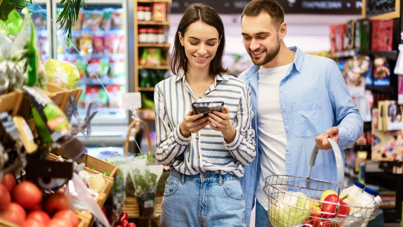 smiling couple shopping for groceries