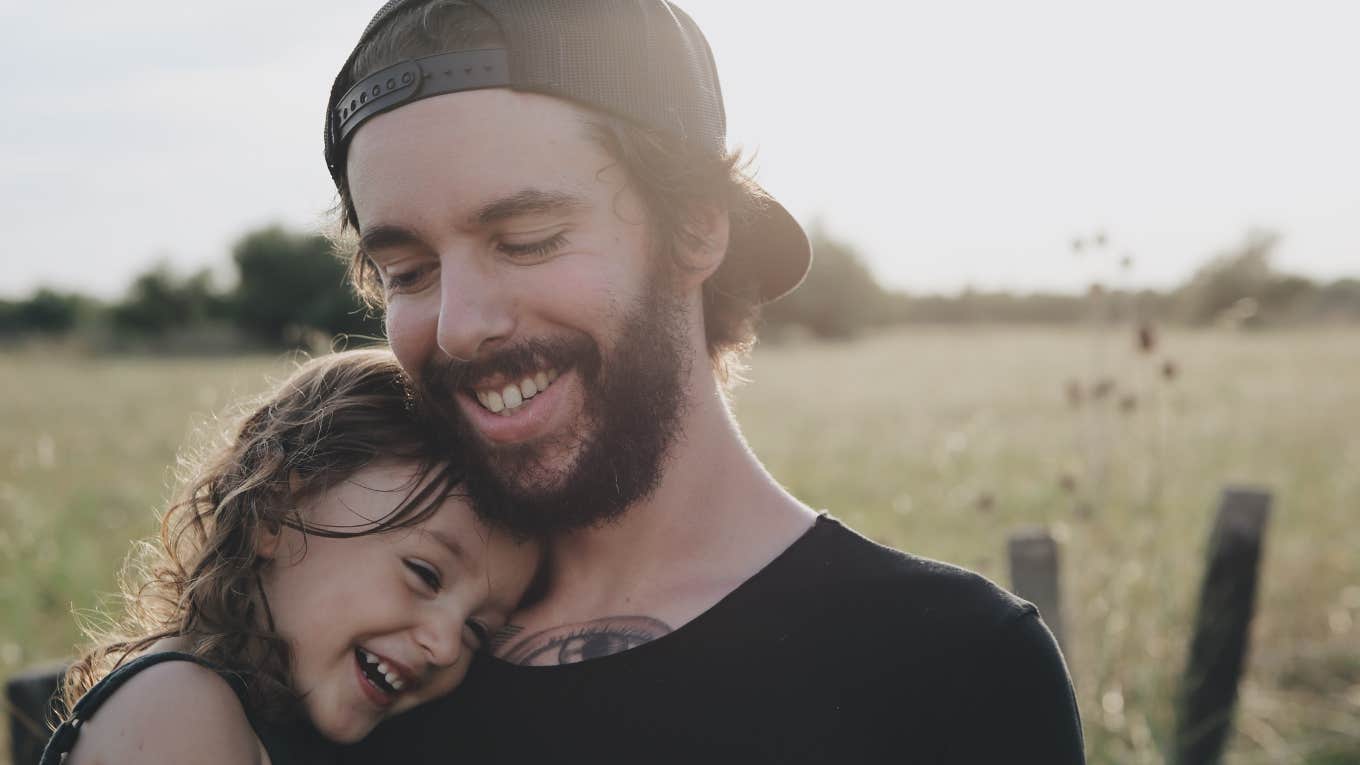 dad hugging daughter 