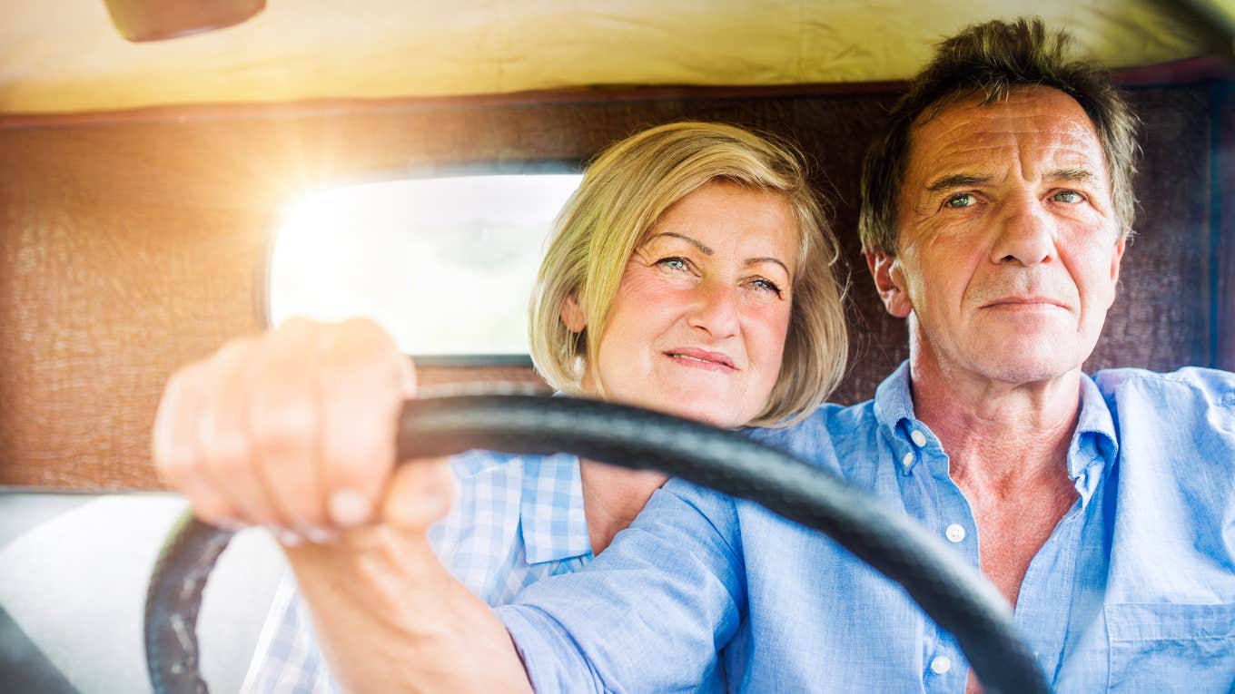 man and woman driving in truck