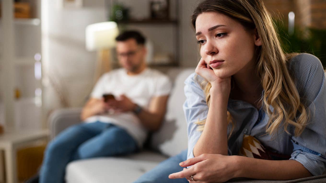 woman crying on couch