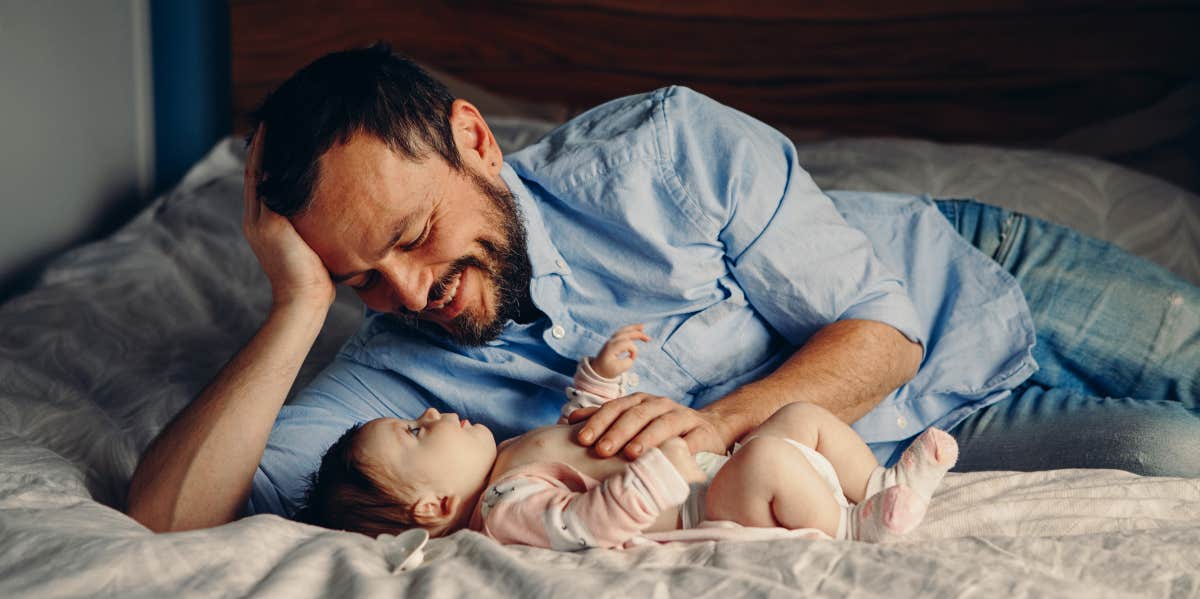 Man Told Wife Not To Put Their Baby In Bed With Him While He's Sleeping Man with his baby on bed