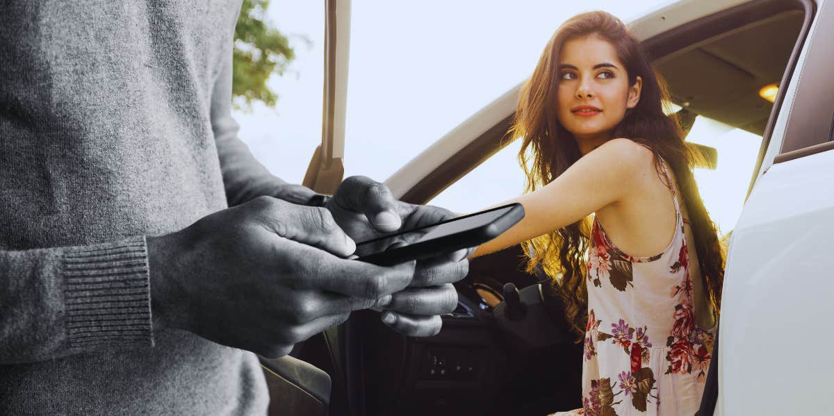 Man on his phone, woman getting out of her car