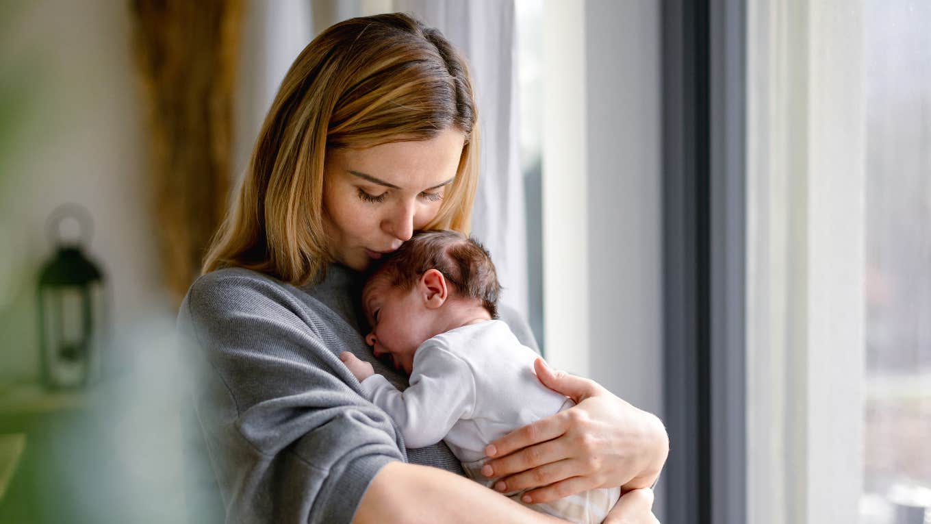 mom caring for newborn baby