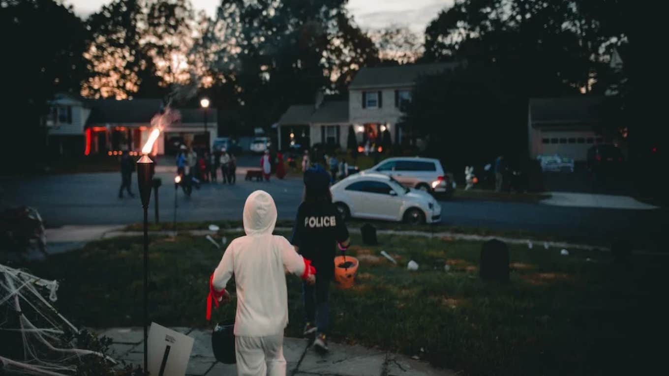 Man Wears A Fake Kids Costume To Fool People Into Giving Him Halloween Candy trick or treating children on halloween