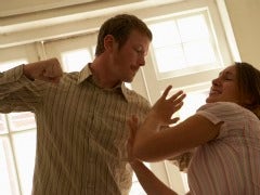 How To Avoid An Abusive Relationship Man with fist raised to hit woman