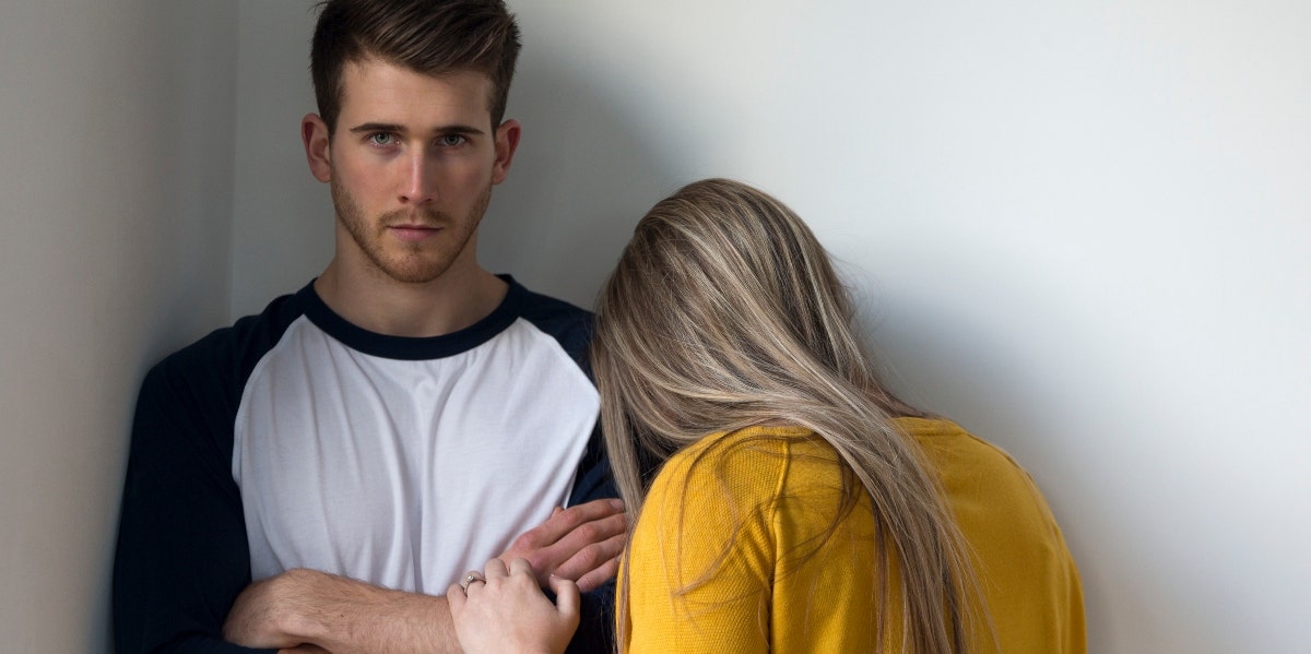 angry looking man with upset woman