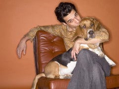Pet Jealousy And How To Deal With It Man sitting with dog