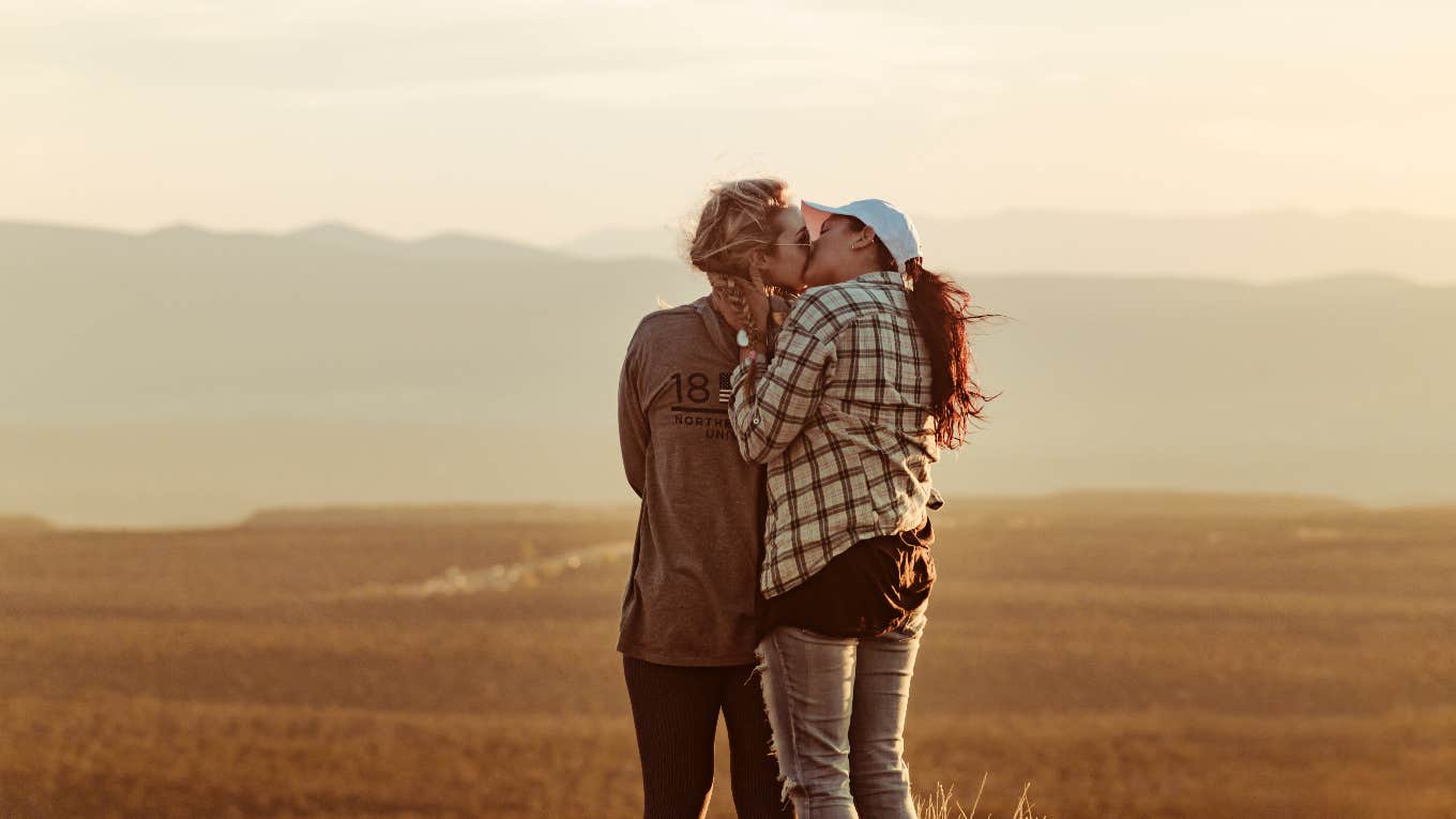 female couple kissing outdoors