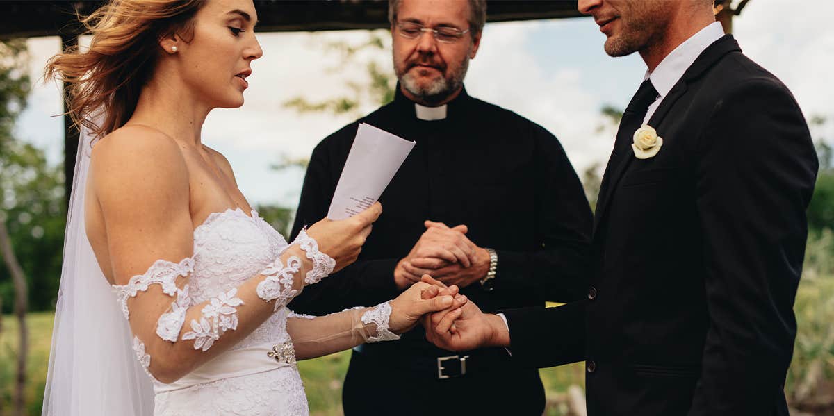 Marriage Advice For Women & Why It’s Sexist To Change Your Last Name When Getting Married couple getting married reading vows