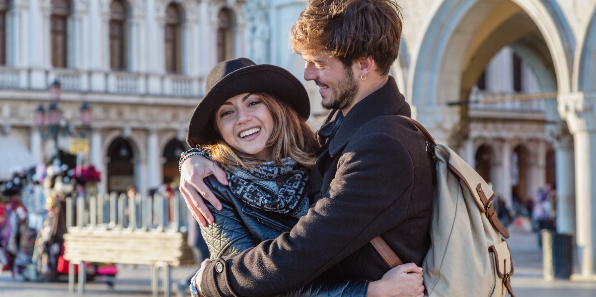 happy man and woman hugging