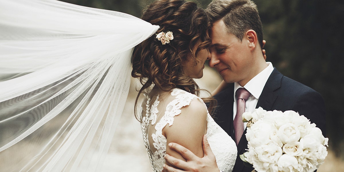 Dangerous Mistakes Women Make When Choosing A Husband bride and groom embracing
