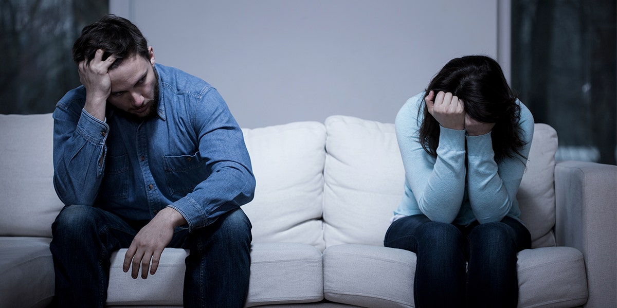 couple arguing on the couch