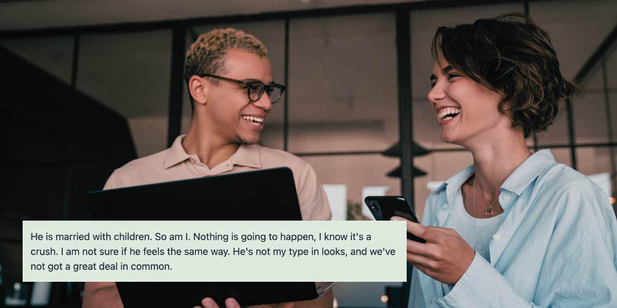 Two coworkers laughing together in office