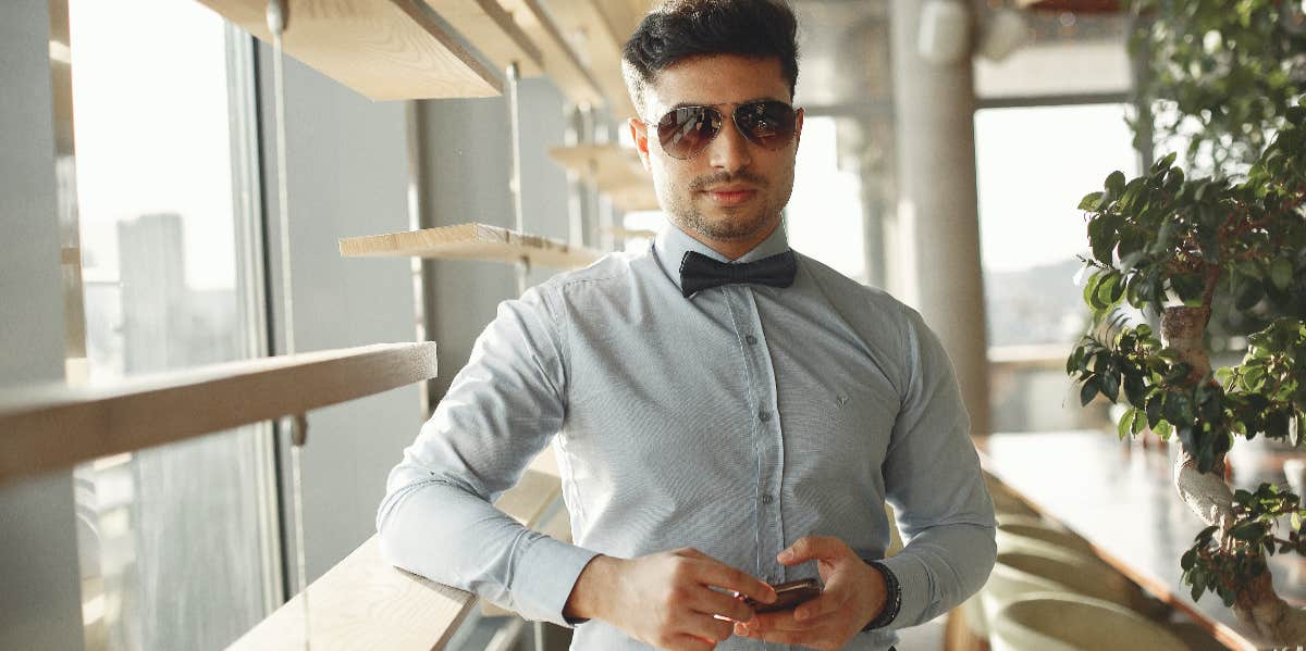 Marry The Man Who Sends You Good Morning Texts handsome man with phone in hand