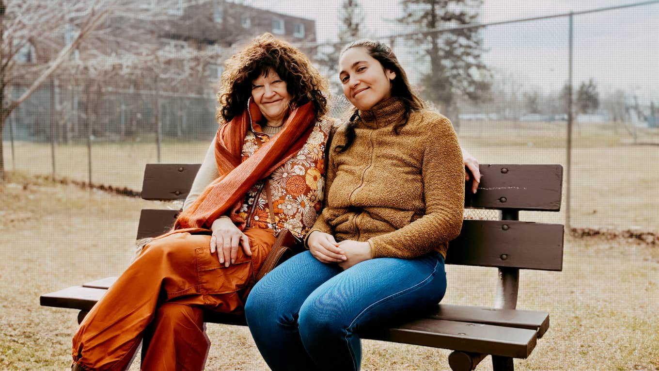 Author and Sue sitting on a park bench together