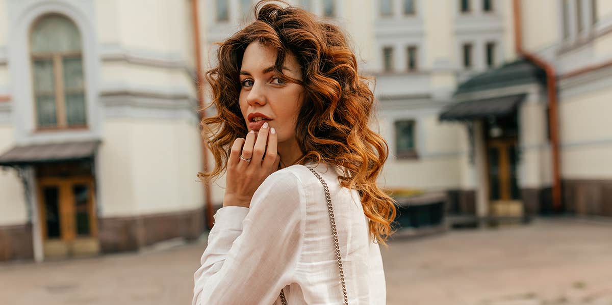 woman looking and walking away