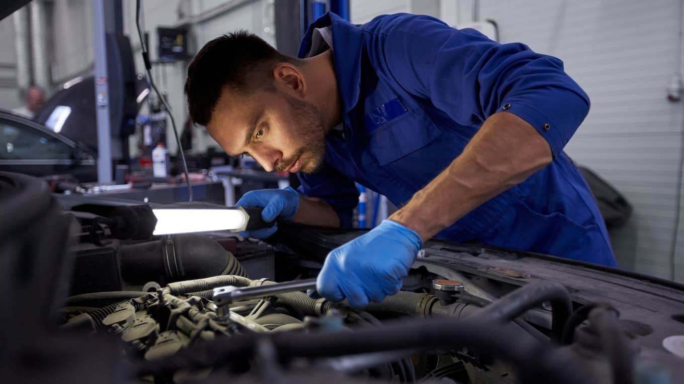 Mechanic fixing a car