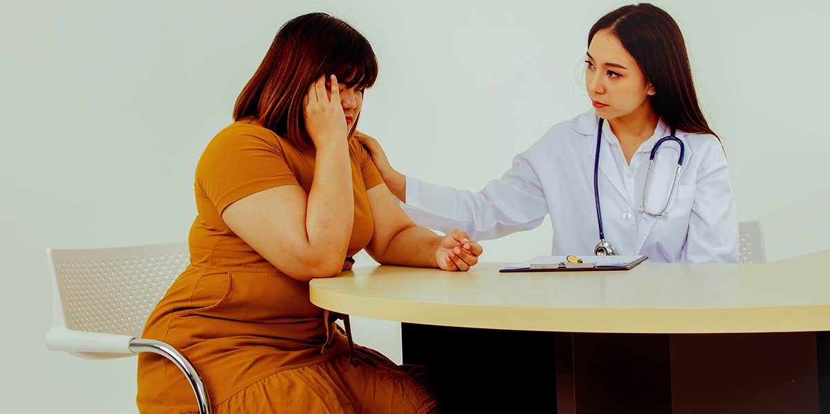 plus sized woman talking to doctor