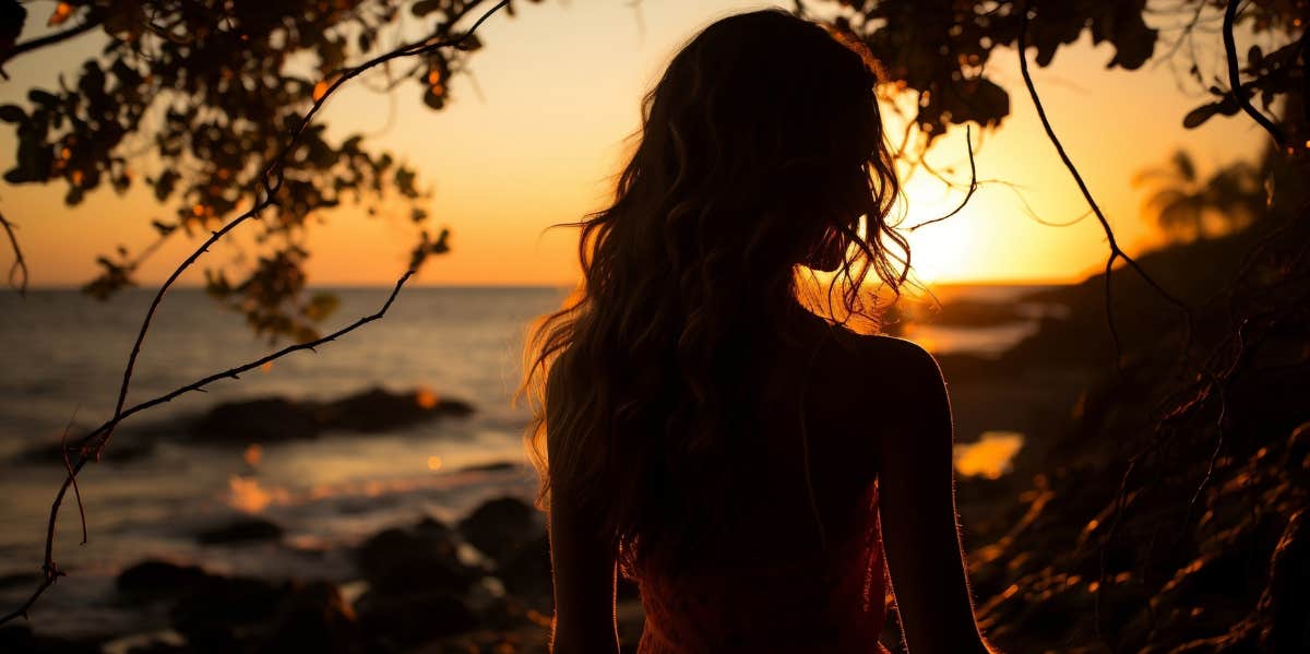 woman looking at sunset