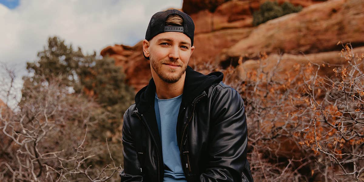 smiling guy in backwards hat