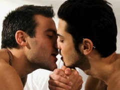 Two men kissing