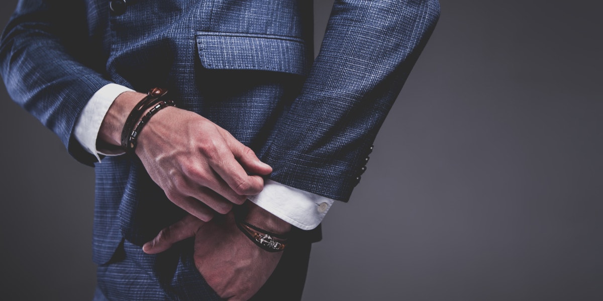 Guys, We Seriously Can't Date You When You're Wearing This Outfit man adjusting cuffs