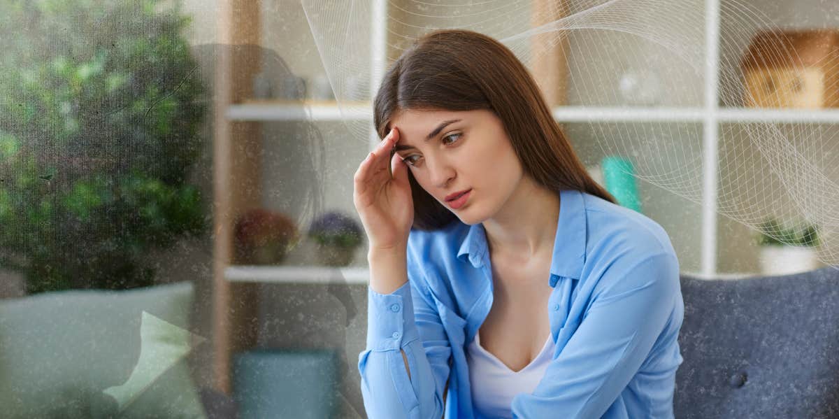 Woman sitting on a couch depressed