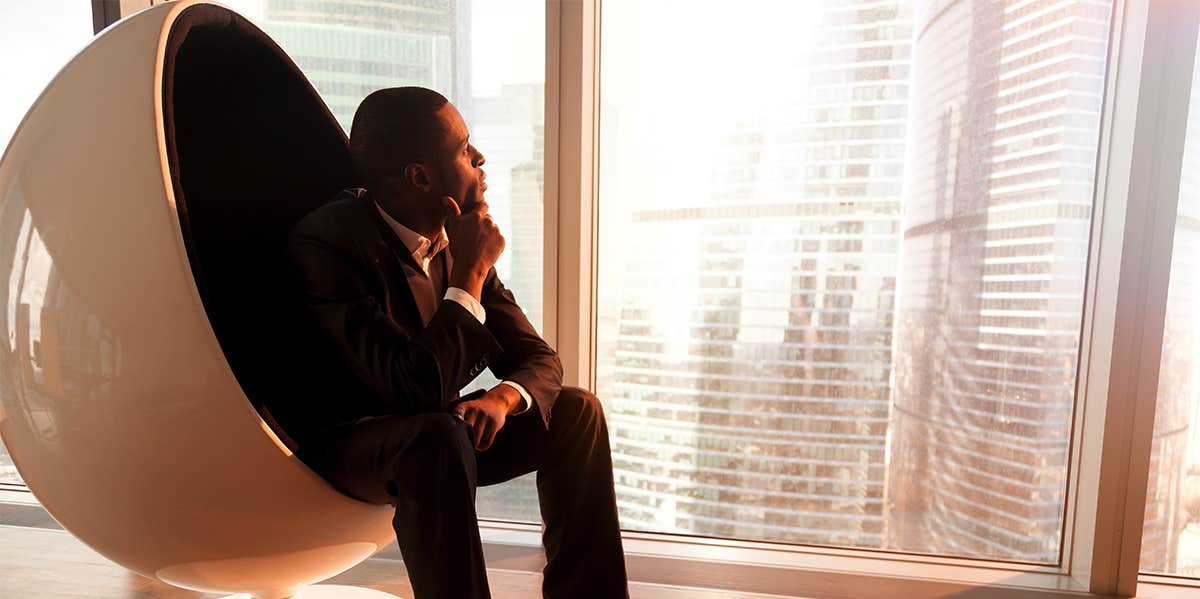 successful man overlooking city view