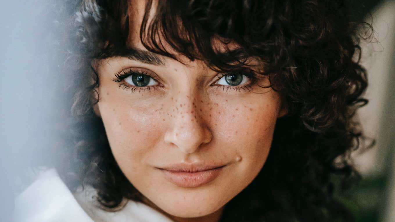 smiling woman with freckles