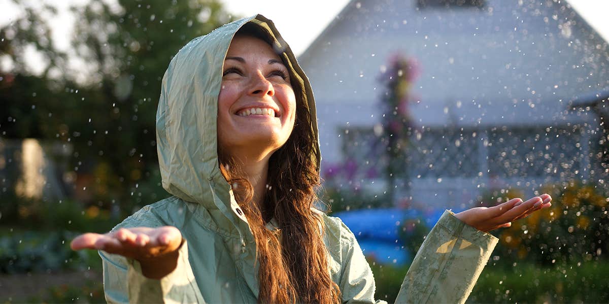 woman smiling in the rain