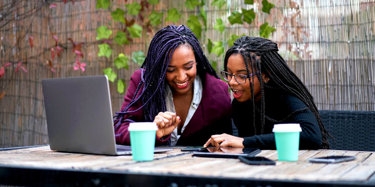 African-American Woman works with younger woman