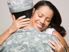 military couple embracing military couple embracing