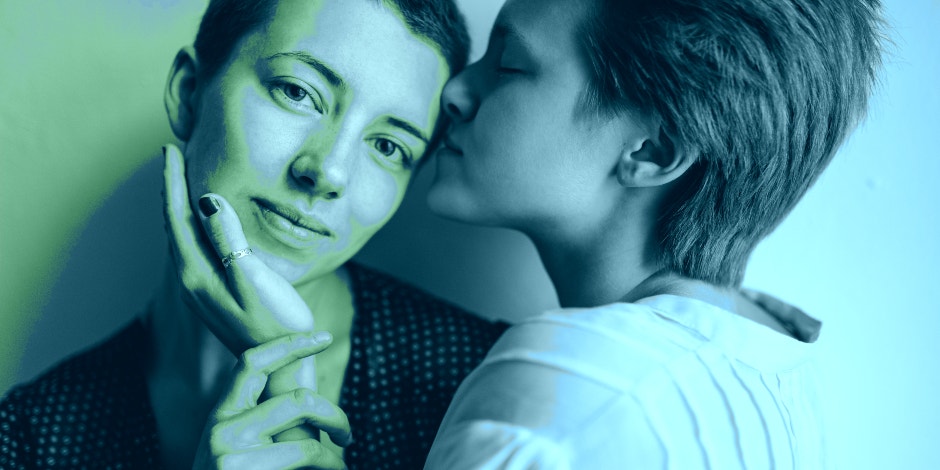 Why Misgendering Me Makes Me Feel Like My Body Is A Problem two people kissing each other in blue haze