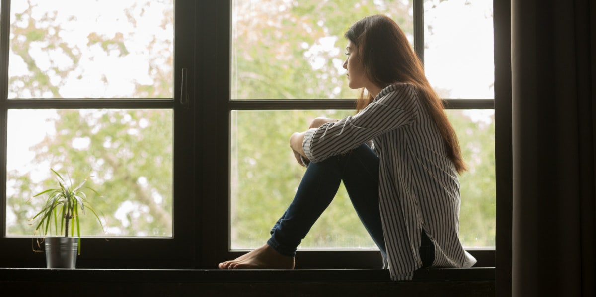 Why I Miss You But I Don't Want You woman looking out the window sad