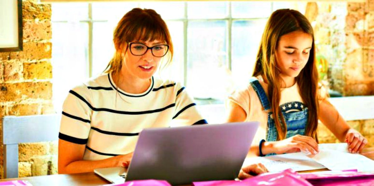 How Those 'Your Child Has Missing Assignments' Emails May Harm Kids During Distance Learning mother and daughter using computers during distance learning