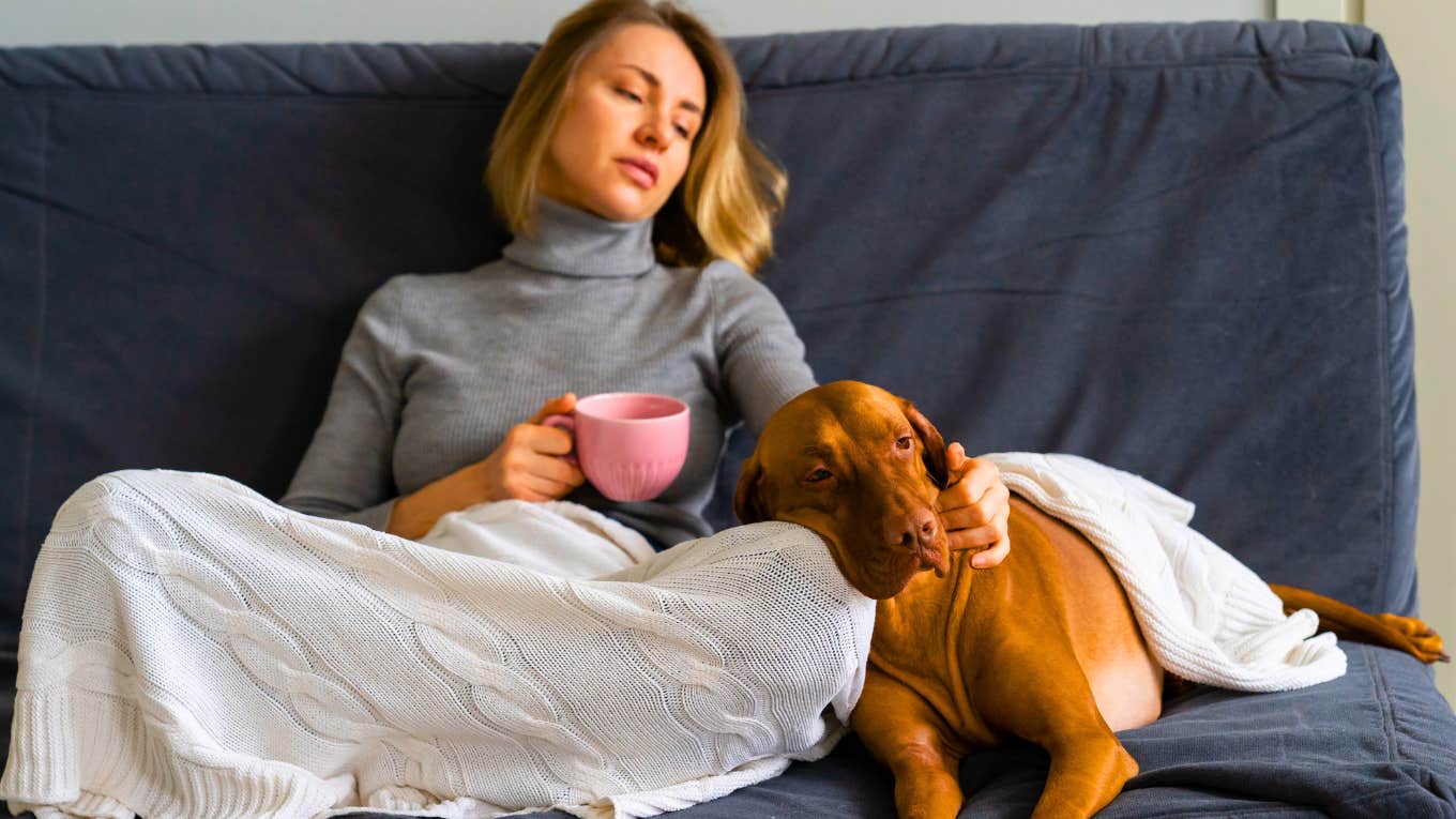 ex-wife sitting with her dog on the couch